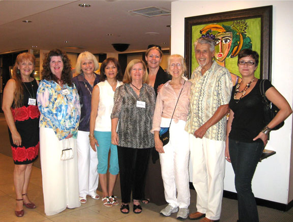 Members of the Miami Art Marketing Salon pose for a group photo at their exhibit opening.