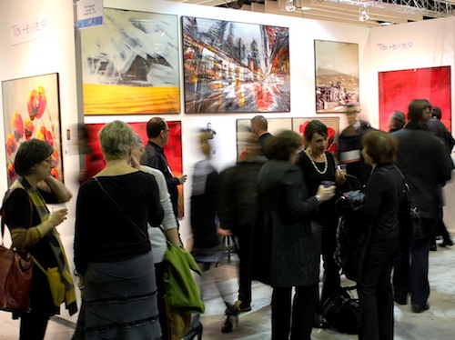 Tibi Hegyesi's booth at Art Expo New York is full of visitors