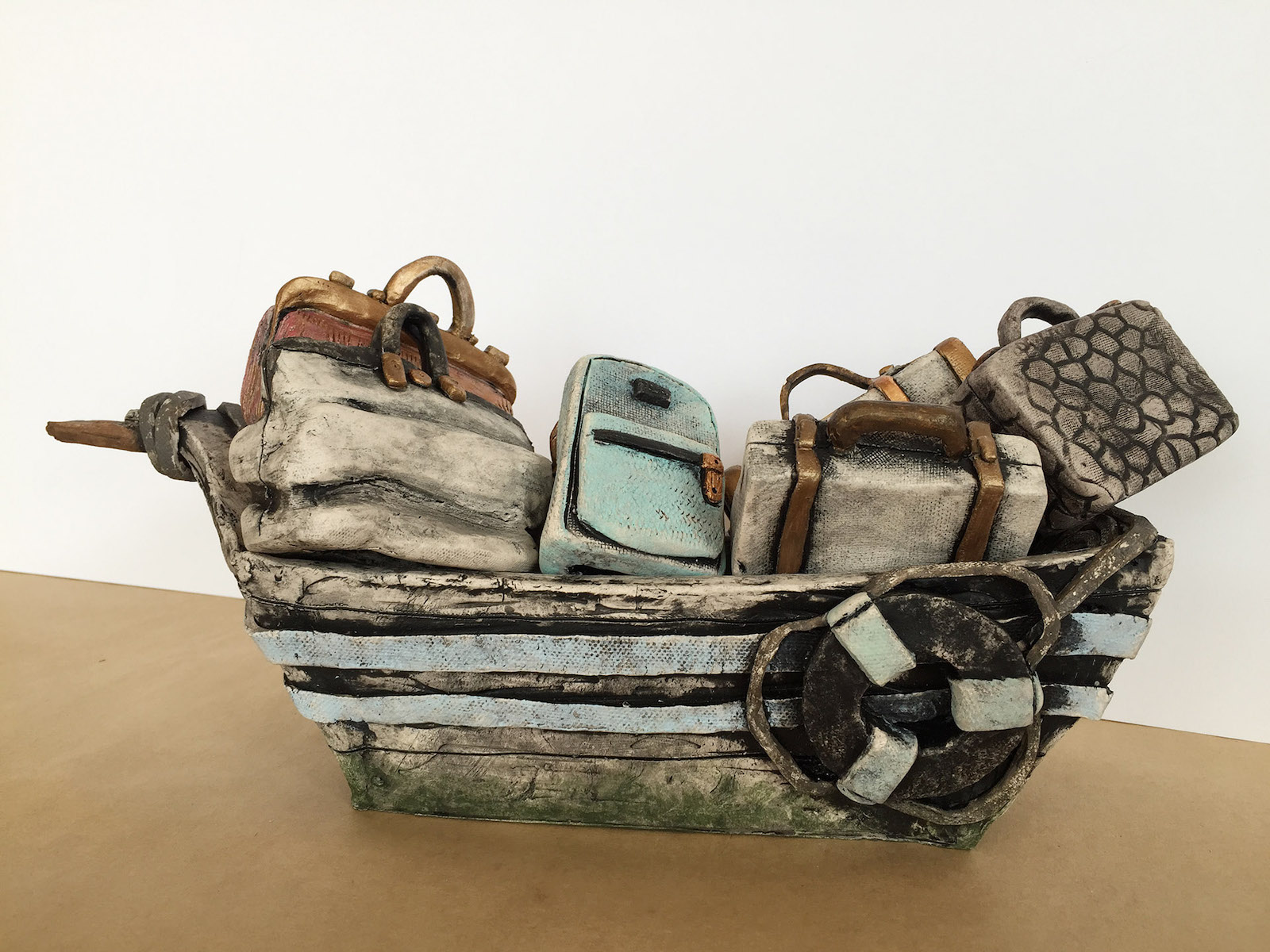 Ceramic Sculpture of a Boat with Luggage by Melinda Laz