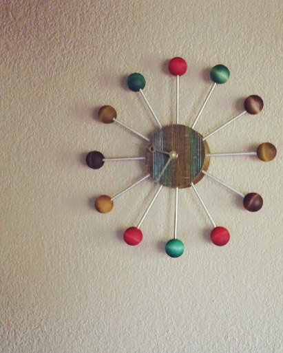 Our favorite clock that hangs over our fireplace. It’s a take on the mid-century design of George Nelson by artist Anne Bossert.