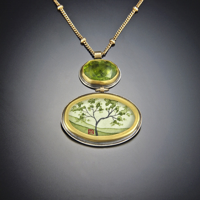 ©Ananda Khalsa, Spring Maple Necklace with Green Tourmaline. Acrylic on watercolor paper below faceted green tourmaline with 22k gold and sterling silver on a 14k gold chain. Used with permission.