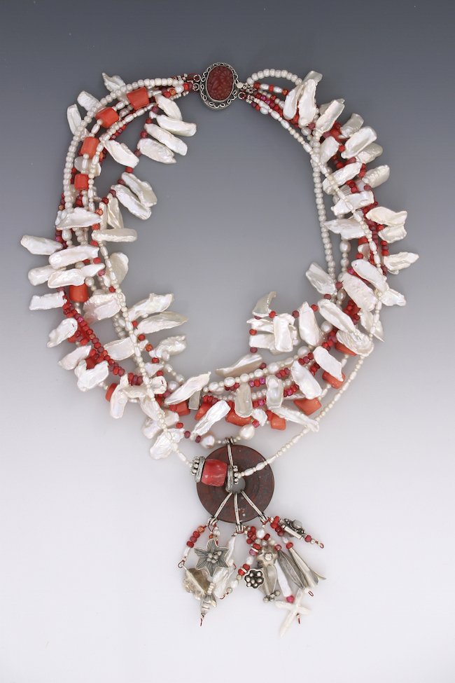 ©Mary Ellen Merrigan, Pearls Plus. Pearl rounds, white Kaishi, coral, glass and sterling silver, 20 inches long. Used with permission.