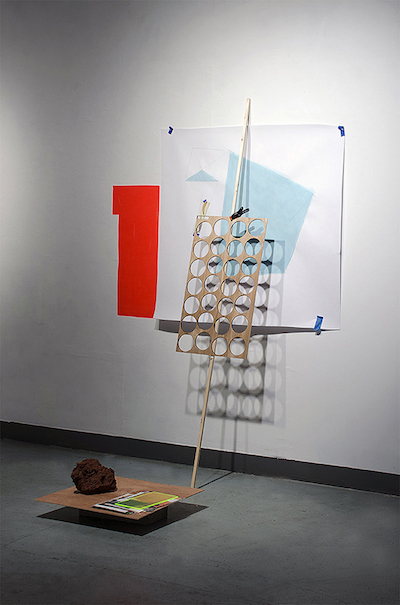 ©Terri Lindbloom, 2.0. Plexi, concrete blocks, found imagery, and clamp, installation. Used with permission. 