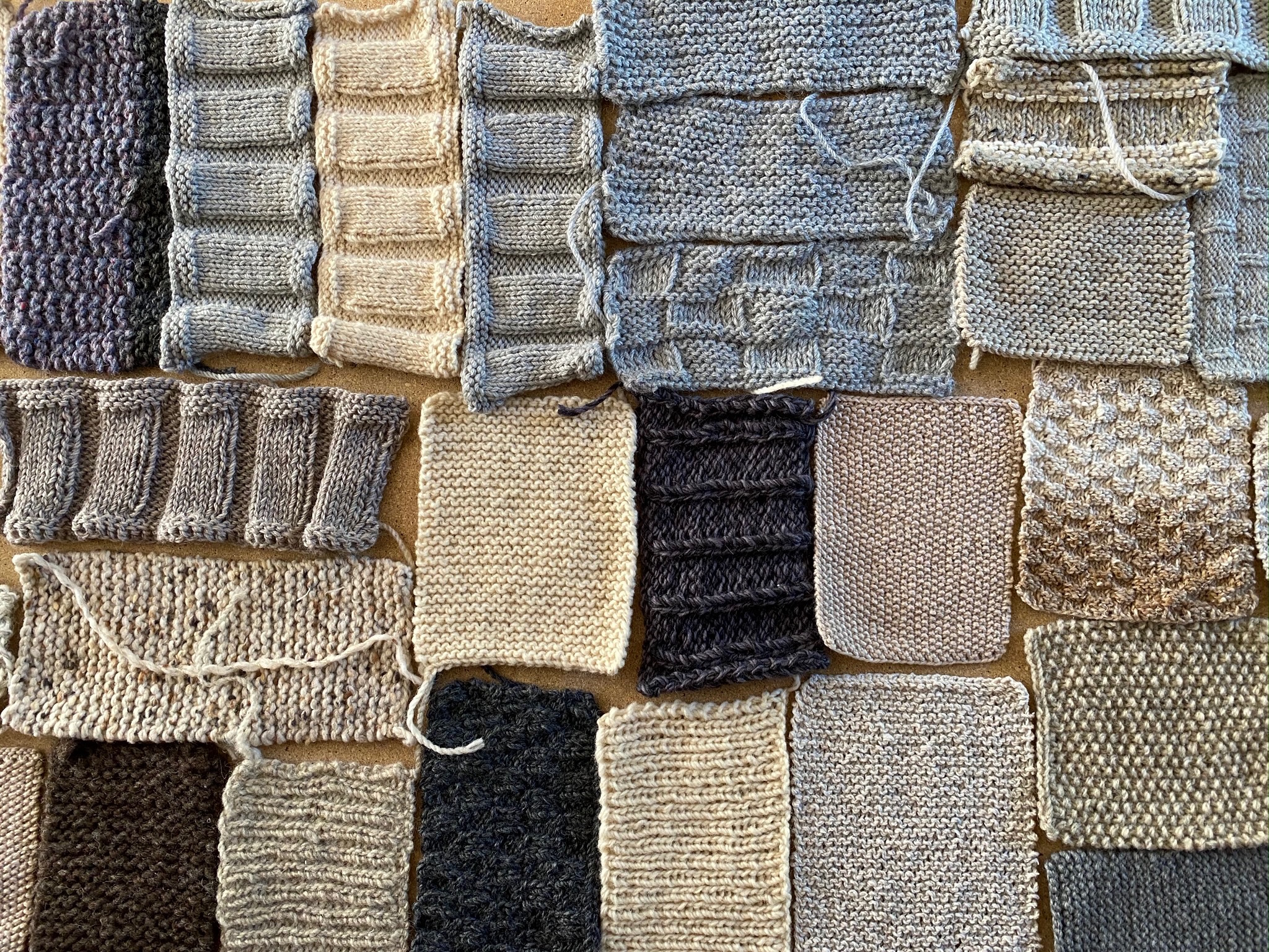 small knitted blocks in blues and tans