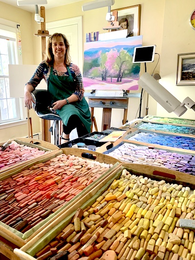 Jeanne Rosier Smith in her studio with her boxes of pastels