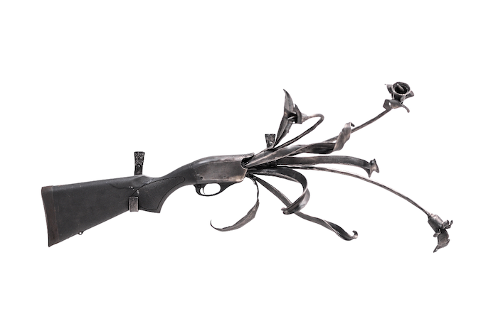 Recycled rifle sculpture by Corrina Sephora