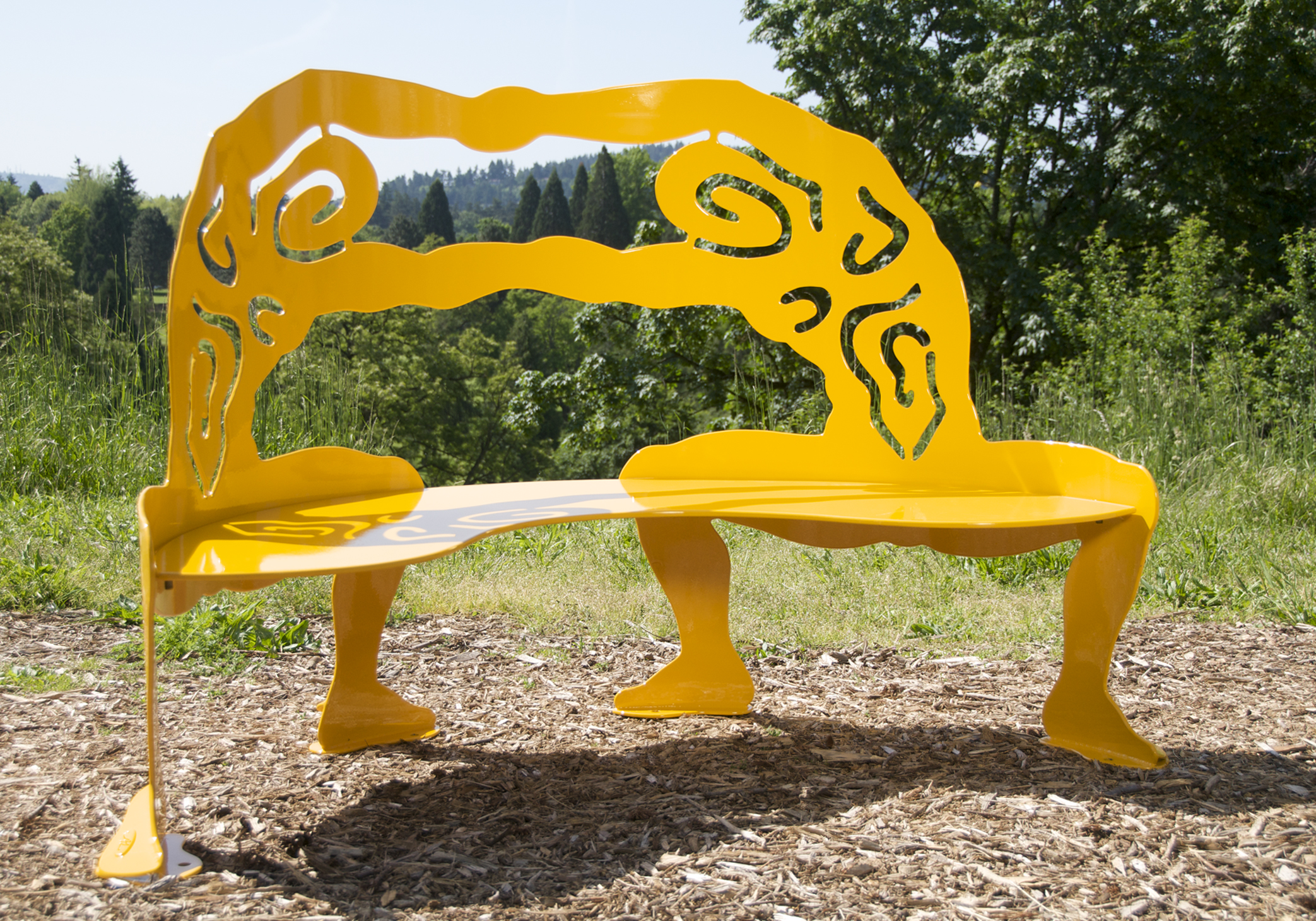 Metal sculpture bench of two yellow abstract figures by Alisa Looney