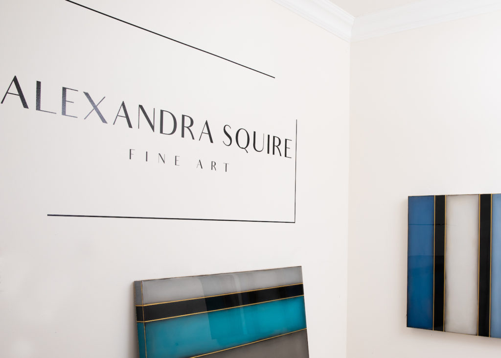 image of a studio wall with Alexandra Squire Fine Art printed on the wall and painting below | on Art Bz Success