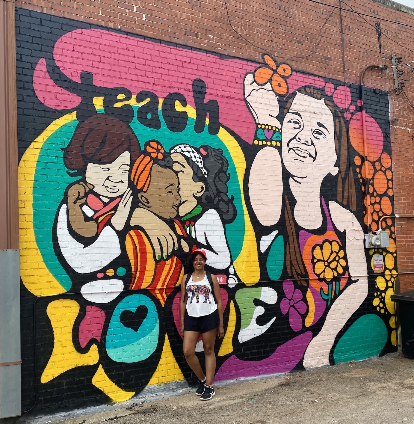 Ebony Iman Dallas with her mural